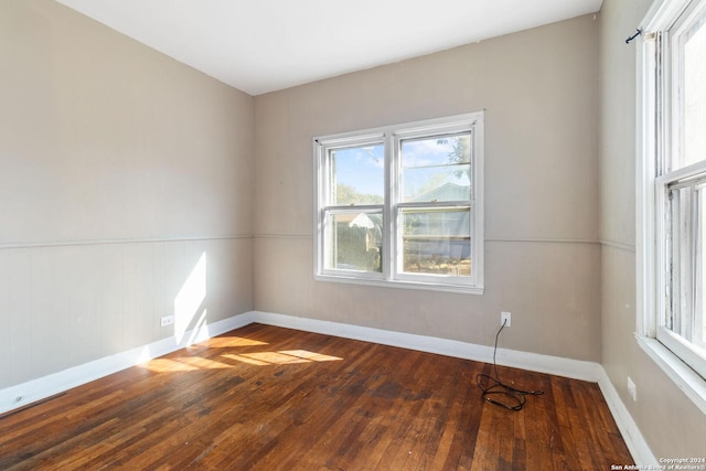 unfurnished room featuring hardwood / wood-style floors