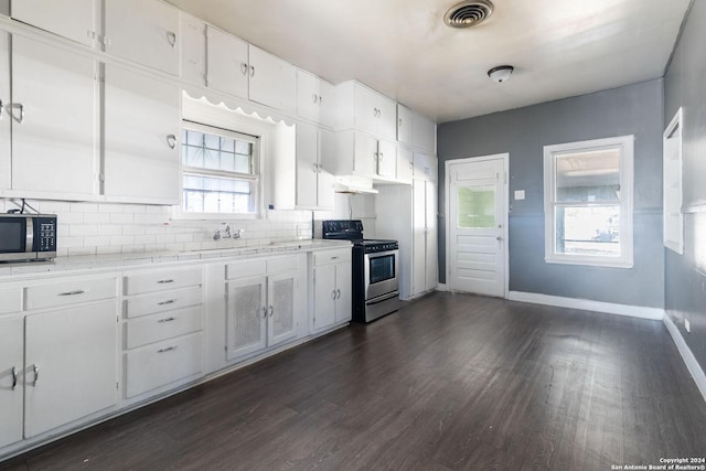 kitchen featuring white cabinets, dark hardwood / wood-style flooring, sink, and appliances with stainless steel finishes