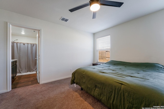 bedroom featuring ceiling fan and dark carpet