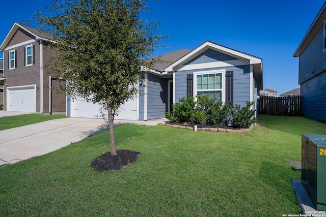 view of front of home featuring a garage and a front yard