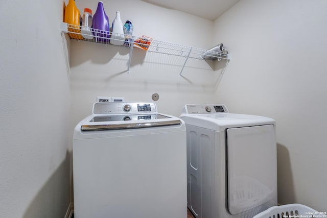 clothes washing area with independent washer and dryer