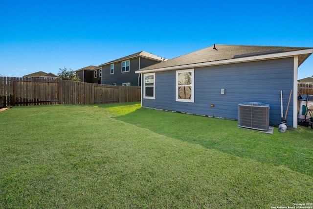 exterior space with a lawn and central AC