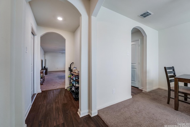 corridor with dark wood-type flooring