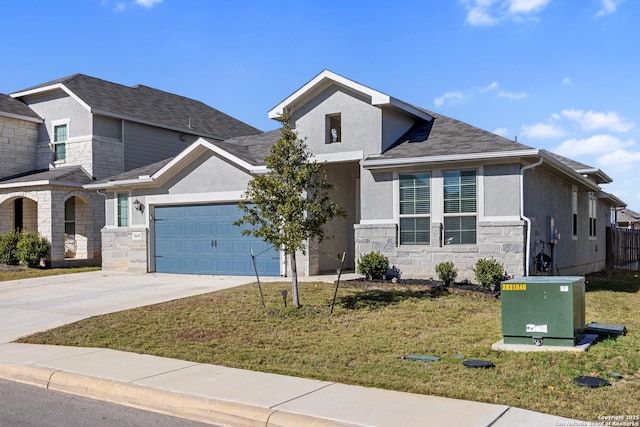 view of front of home with a garage and a front yard