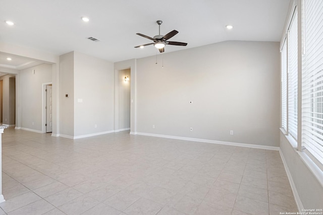 tiled empty room featuring ceiling fan and lofted ceiling