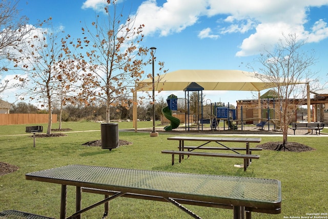 view of home's community featuring a lawn and a playground