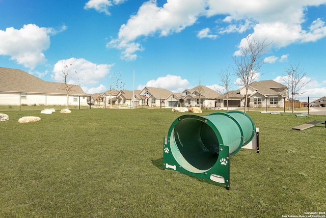 view of property's community featuring a lawn