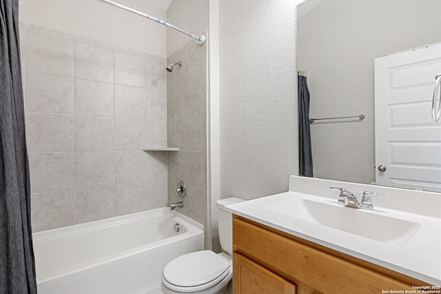 full bathroom featuring shower / tub combo with curtain, vanity, and toilet