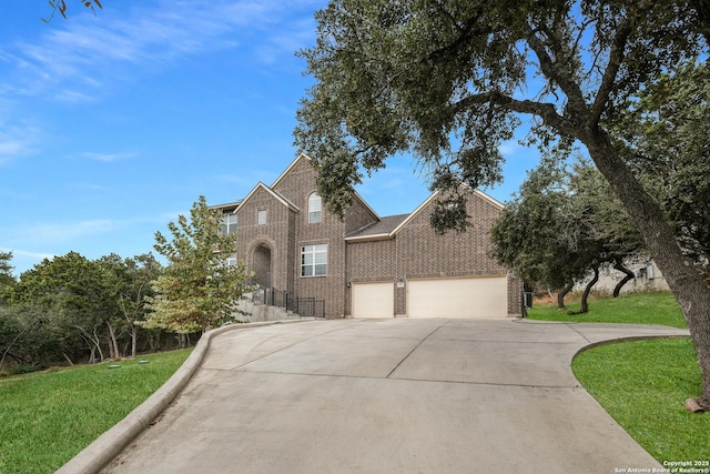 view of front of home with a front lawn and a garage