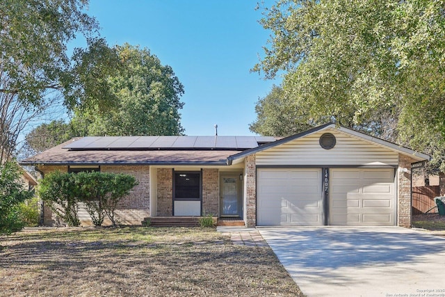 single story home featuring solar panels