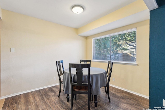 dining space featuring dark hardwood / wood-style floors