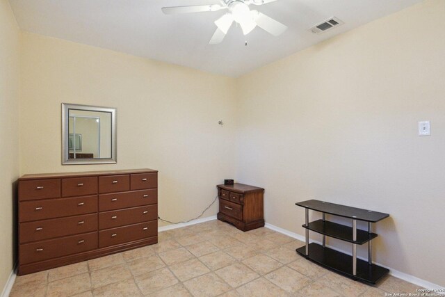 interior space with ceiling fan