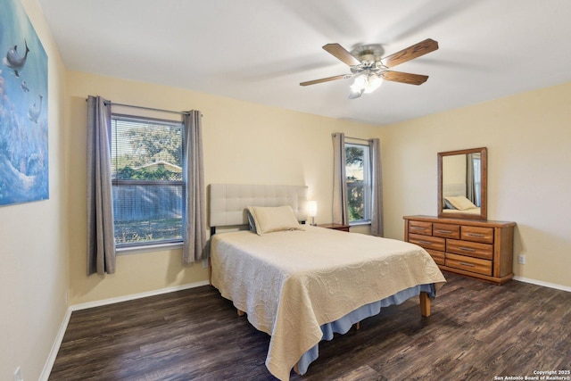 bedroom featuring ceiling fan and dark hardwood / wood-style floors