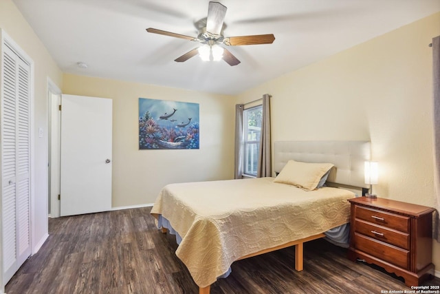 bedroom with a closet, ceiling fan, and dark wood-type flooring