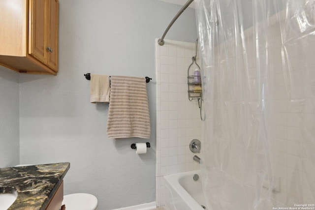 full bathroom featuring vanity, shower / tub combo, and toilet