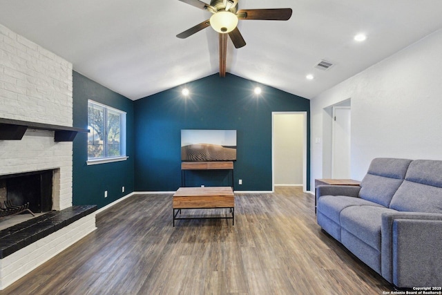 living room featuring vaulted ceiling with beams, ceiling fan, dark hardwood / wood-style flooring, and a fireplace