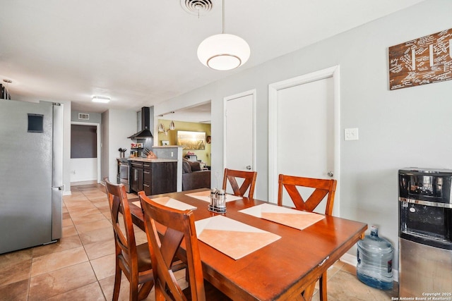 dining space with light tile patterned floors