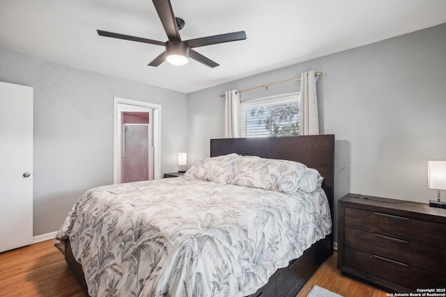 bedroom with ceiling fan and light wood-type flooring