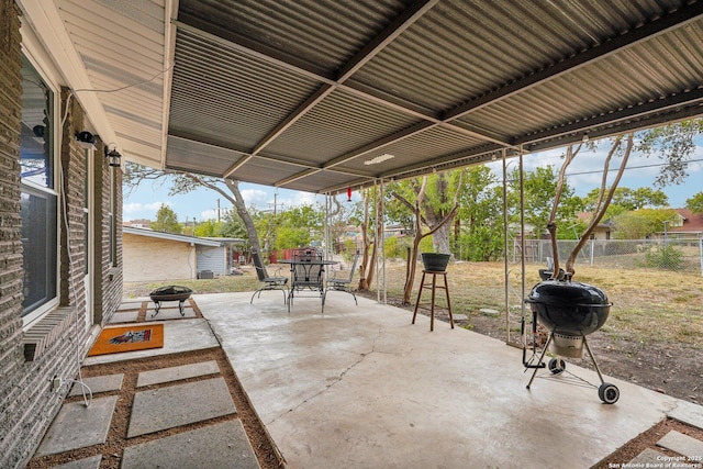 view of patio / terrace with grilling area and an outdoor fire pit