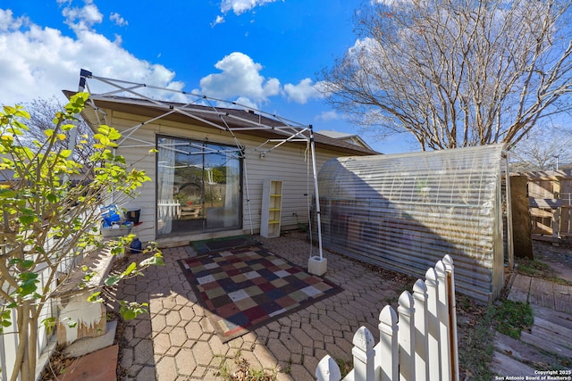 back of property featuring a patio