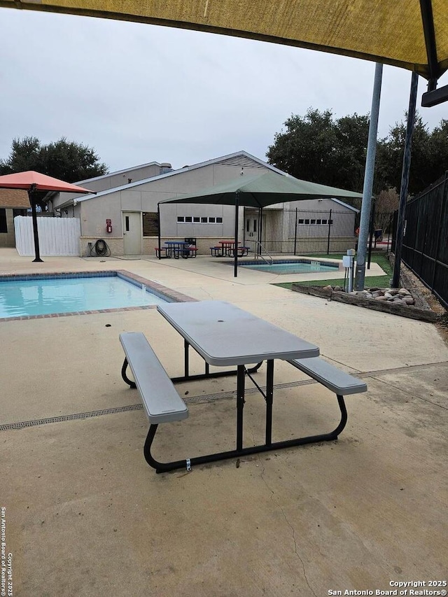 view of pool featuring a patio area