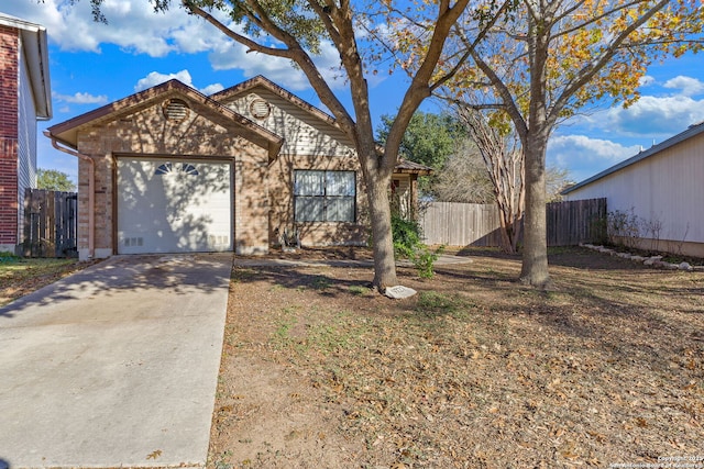 single story home featuring a garage