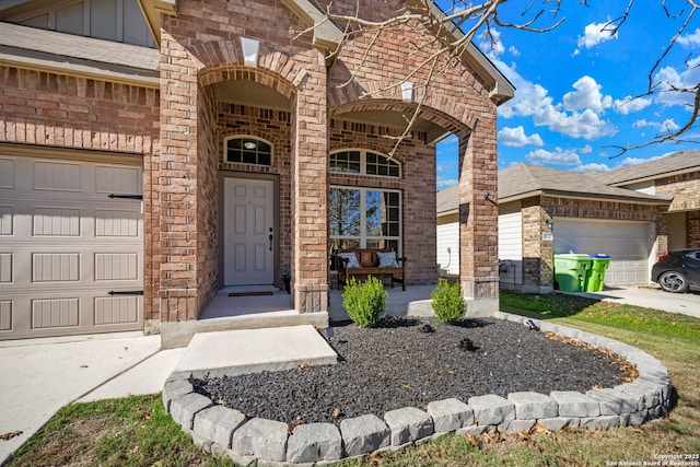 view of exterior entry with a garage