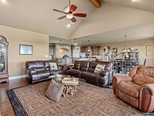 living room with beamed ceiling, ceiling fan, hardwood / wood-style floors, and high vaulted ceiling