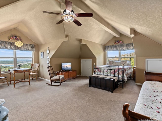 carpeted bedroom featuring ceiling fan, a textured ceiling, and vaulted ceiling