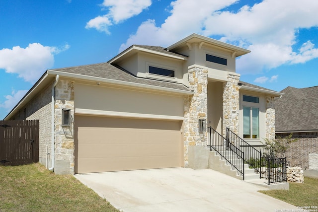 prairie-style home featuring a garage