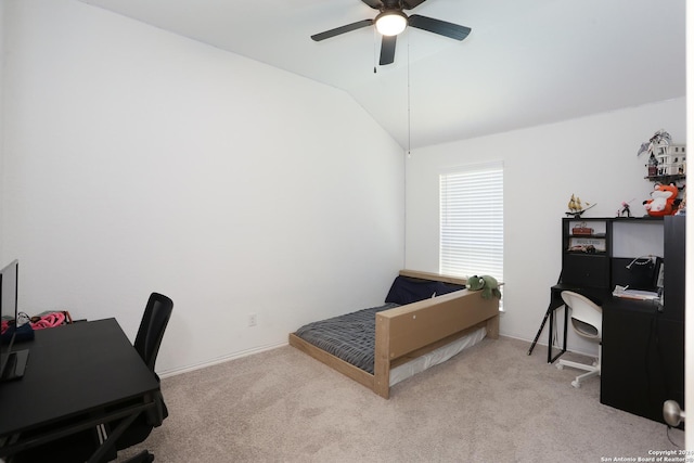 carpeted bedroom featuring ceiling fan and vaulted ceiling