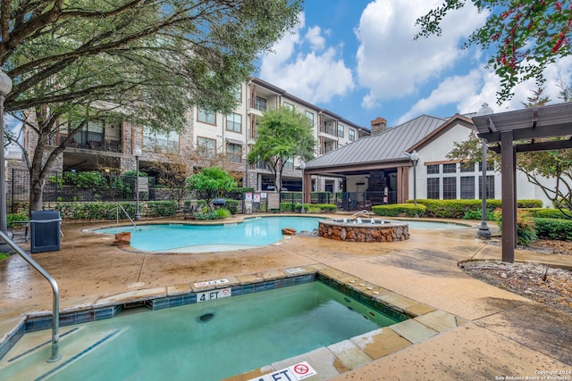 view of pool featuring a hot tub and a pergola