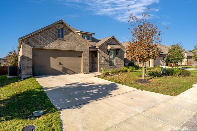 view of front of home with central AC, a front lawn, and a garage