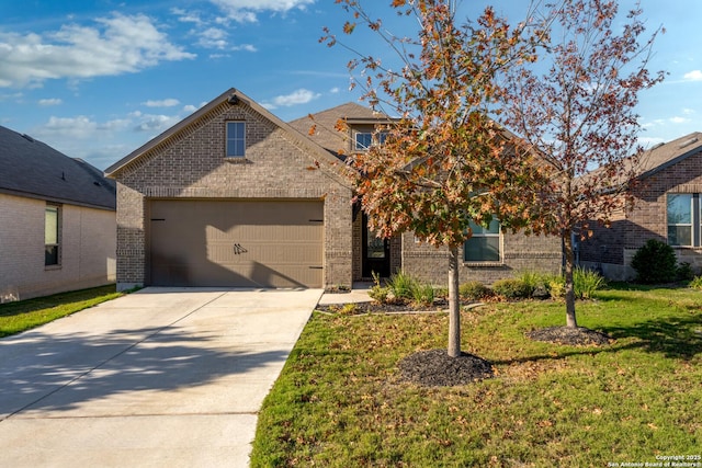 view of front of property featuring a garage and a front lawn