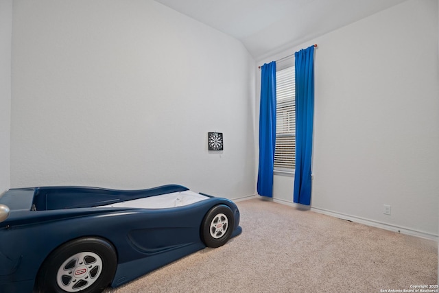 bedroom featuring lofted ceiling