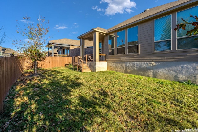 rear view of house with a lawn