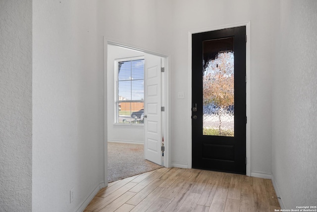 entryway with light hardwood / wood-style floors