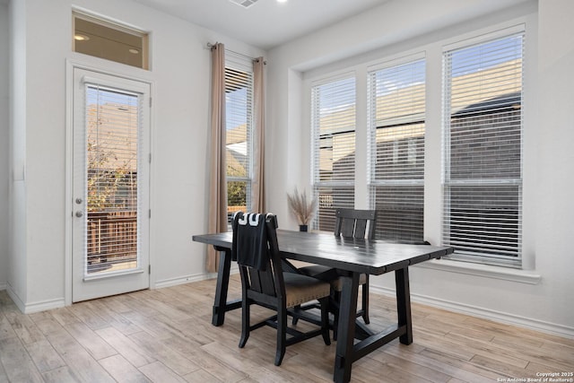 dining room with light wood-type flooring