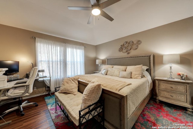 bedroom featuring ceiling fan and dark wood-type flooring