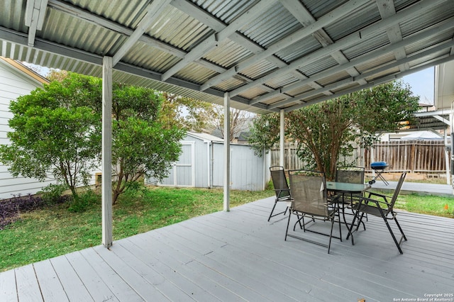 deck featuring a yard and a shed