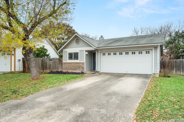 view of front facade with a front lawn and a garage