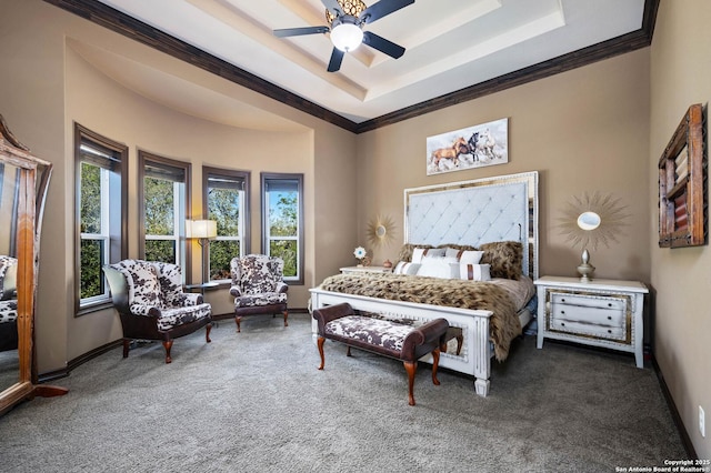 bedroom with a raised ceiling, ceiling fan, crown molding, and carpet floors