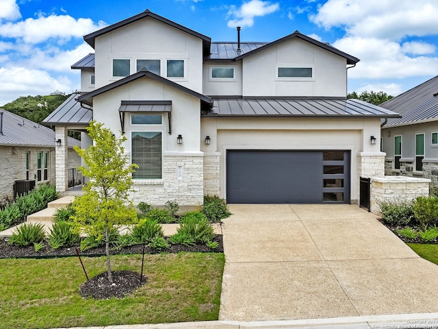 view of front facade with a garage, central air condition unit, and a front yard