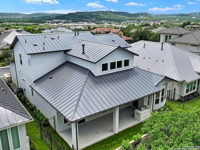 birds eye view of property with a mountain view