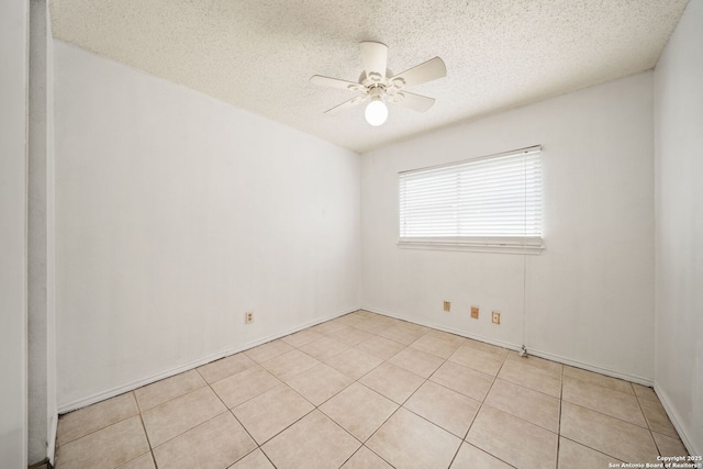 unfurnished room featuring light tile patterned floors, a textured ceiling, and ceiling fan