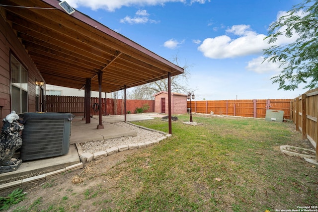 view of yard featuring a patio area, a shed, and central AC