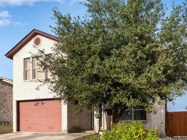 obstructed view of property with a garage