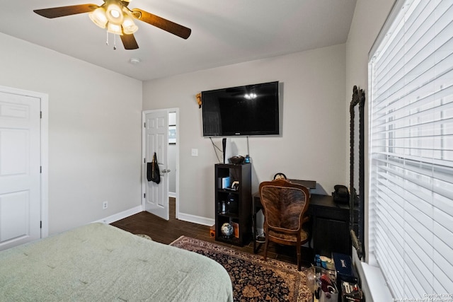 bedroom with ceiling fan and dark wood-type flooring