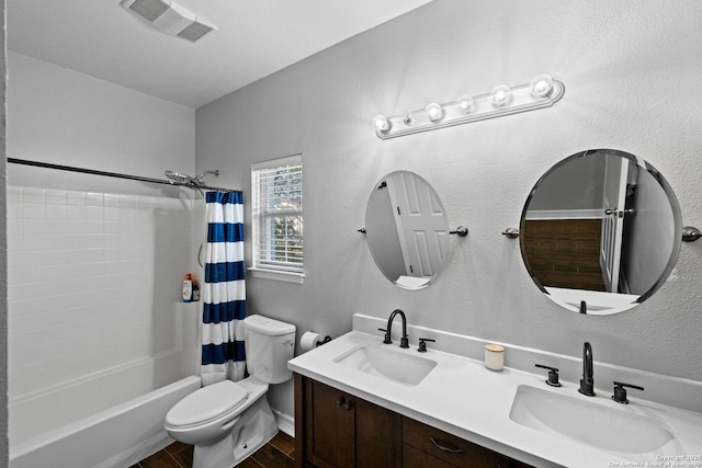 full bathroom with shower / bath combo, toilet, and vanity