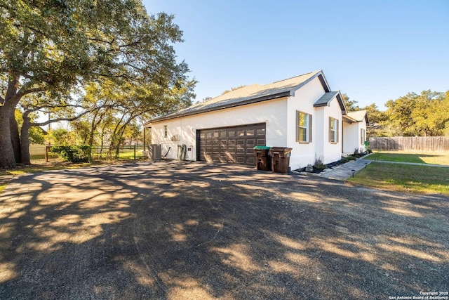 view of property exterior featuring a garage